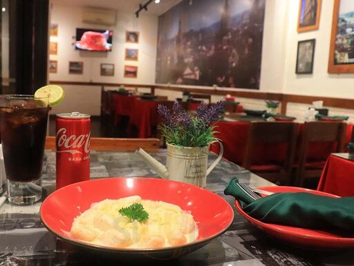 Pasta served in restaurant interior