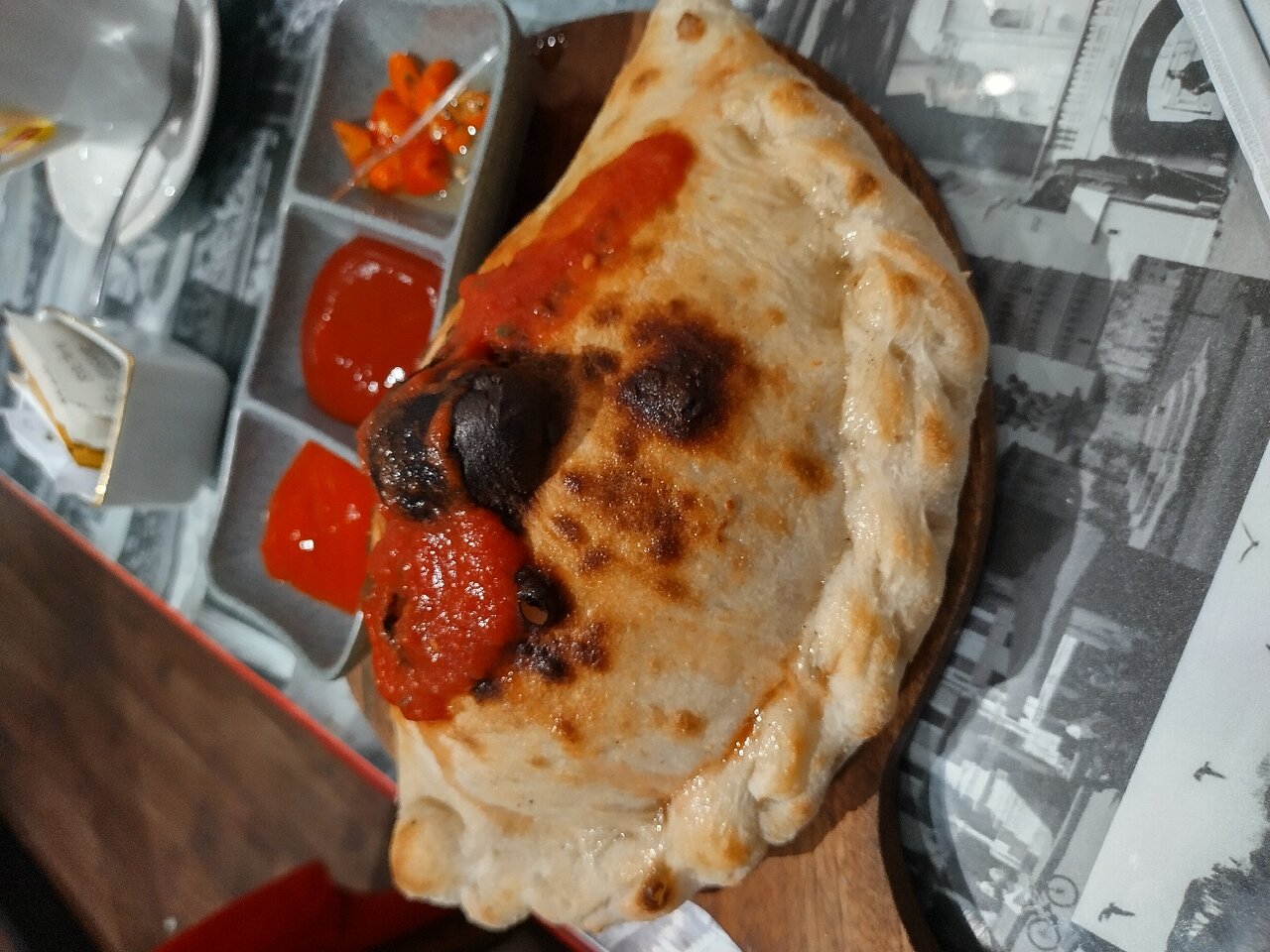 Calzone and tomato sauce